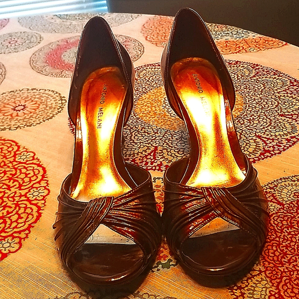 Open sided brown patent pumps